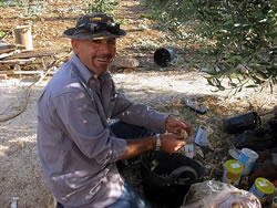 Murad preparing to plant seeds and trees